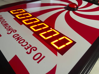 10 Second challenge - Close-up of a digital timer on game board with red and white design