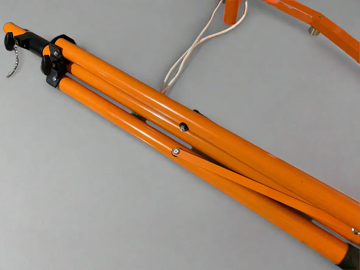 Orange metal stand on a gray background