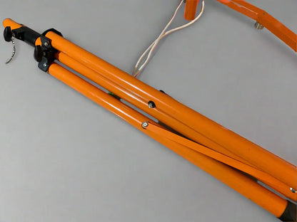 Orange metal stand on a gray background