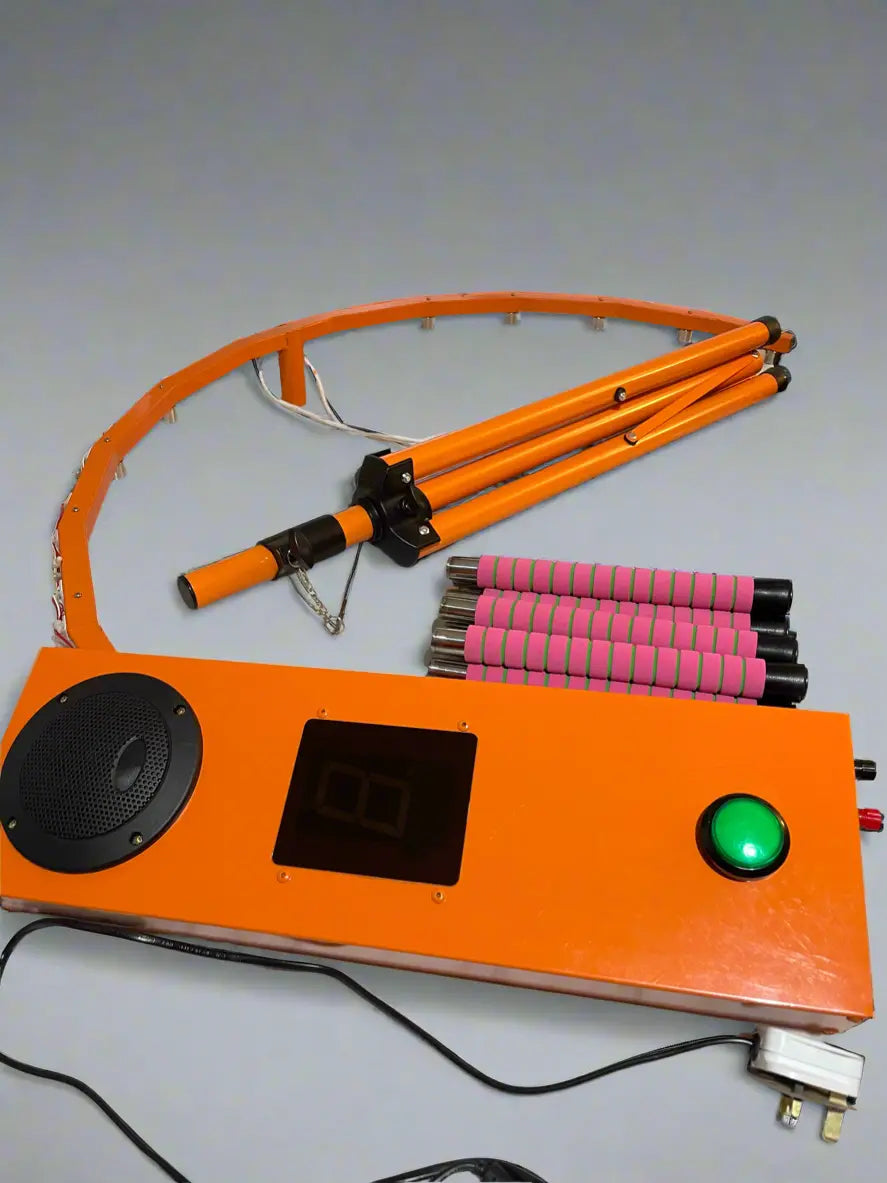 Orange electronic device with a green button and digital display on a gray background